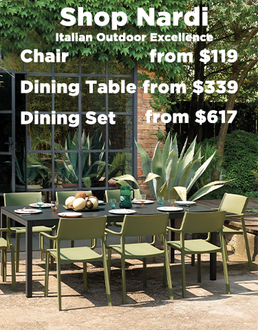 A vibrant outdoor setting featuring some amazing Nardi outdoor furniture pieces. There is a long black extension table and 10 yellow outdoor chairs on a wooden deck, set with food for a welcoming atmosphere.