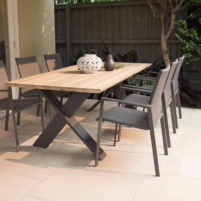 Aluminium Eden outdoor dining furniture set, featuring outdoor chairs around a wooden table with a vase.