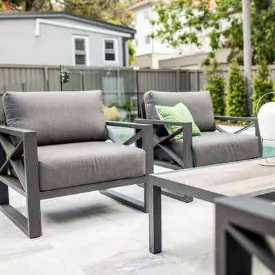 Outdoor furniture collection featuring aluminium outdoor lounge chair, two-seater, and three-seater sofas in charcoal or white, perfect for backyard gatherings.