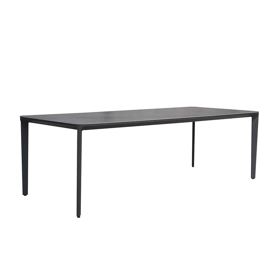 Black & grey, ceramic & aluminium Carson outdoor dining table displayed on a plain white background, viewed from a front angle.
