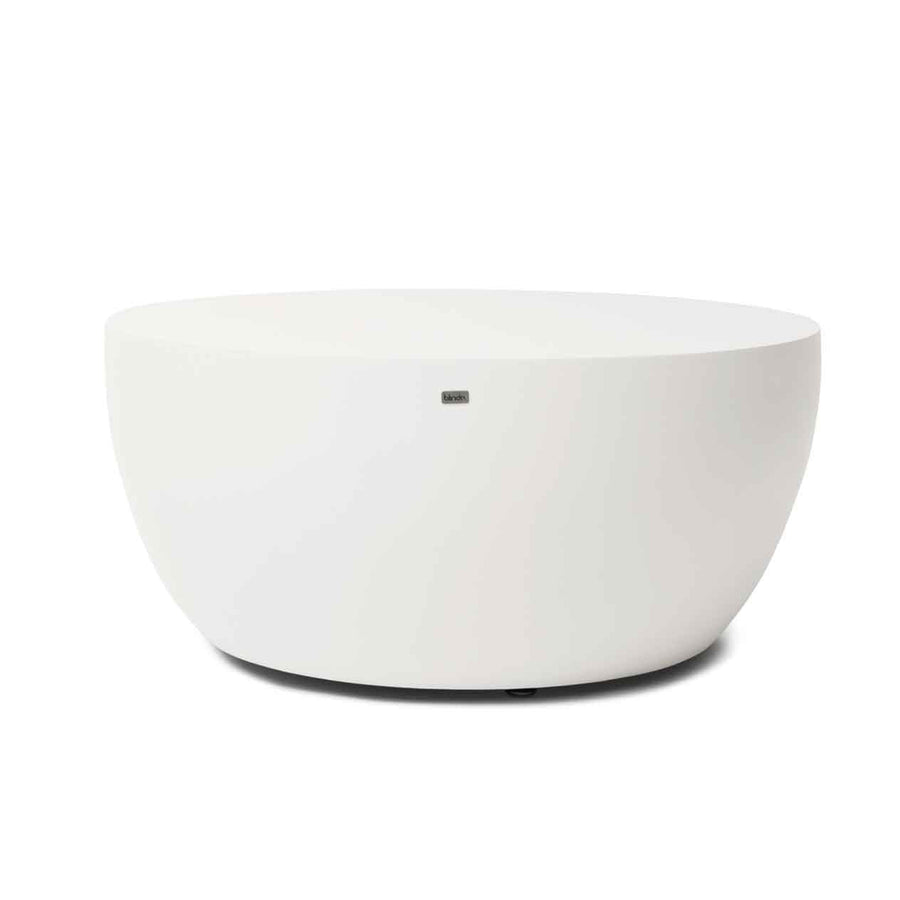 White circular concrete coffee table set against a plain white background, perfect for outdoor furniture arrangements.