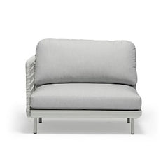 Outdoor furniture from the Colwood Collection featuring a wicker lounge chair, outdoor dining furniture, and a rope end chair with a light grey frame and cushion against a white background.