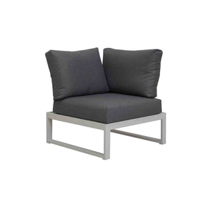 Versatile Denver sofa in charcoal and white, a piece of aluminum outdoor furniture that can be a one-seater, corner chair, three-seater, or sunlounger, featuring a corner chair with a cushion on top of it.