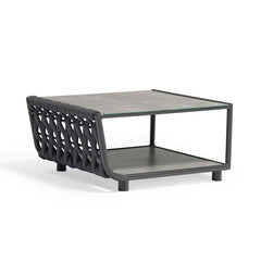 Outdoor furniture from the Lawson Collection, featuring a wicker lounge chair, outdoor dining furniture, and a rope coffee table with charcoal frame and a ceramic glass top on a white background.