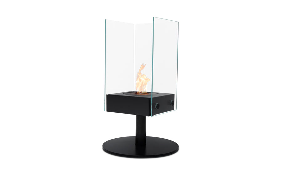 Firepit on a black stand with safety glass surrounding it, set against a plain white background, perfect for outdoor furniture settings.
