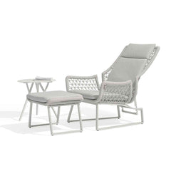 A light-grey modern outdoor furniture balcony setup made from rope featuring an adjustable sleek chair, matching footrest, and a low coffee table. The furniture is arranged on a plain white background.