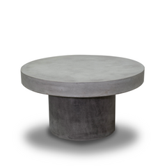 Zen round outdoor concrete coffee table, 90 cm, set on a plain white background. The coffee table has a dark-grey weathered cement colour.