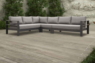 A contemporary 6 seater outdoor lounge featuring sleek lines and grey cushions, perfect for stylish outdoor lounging.