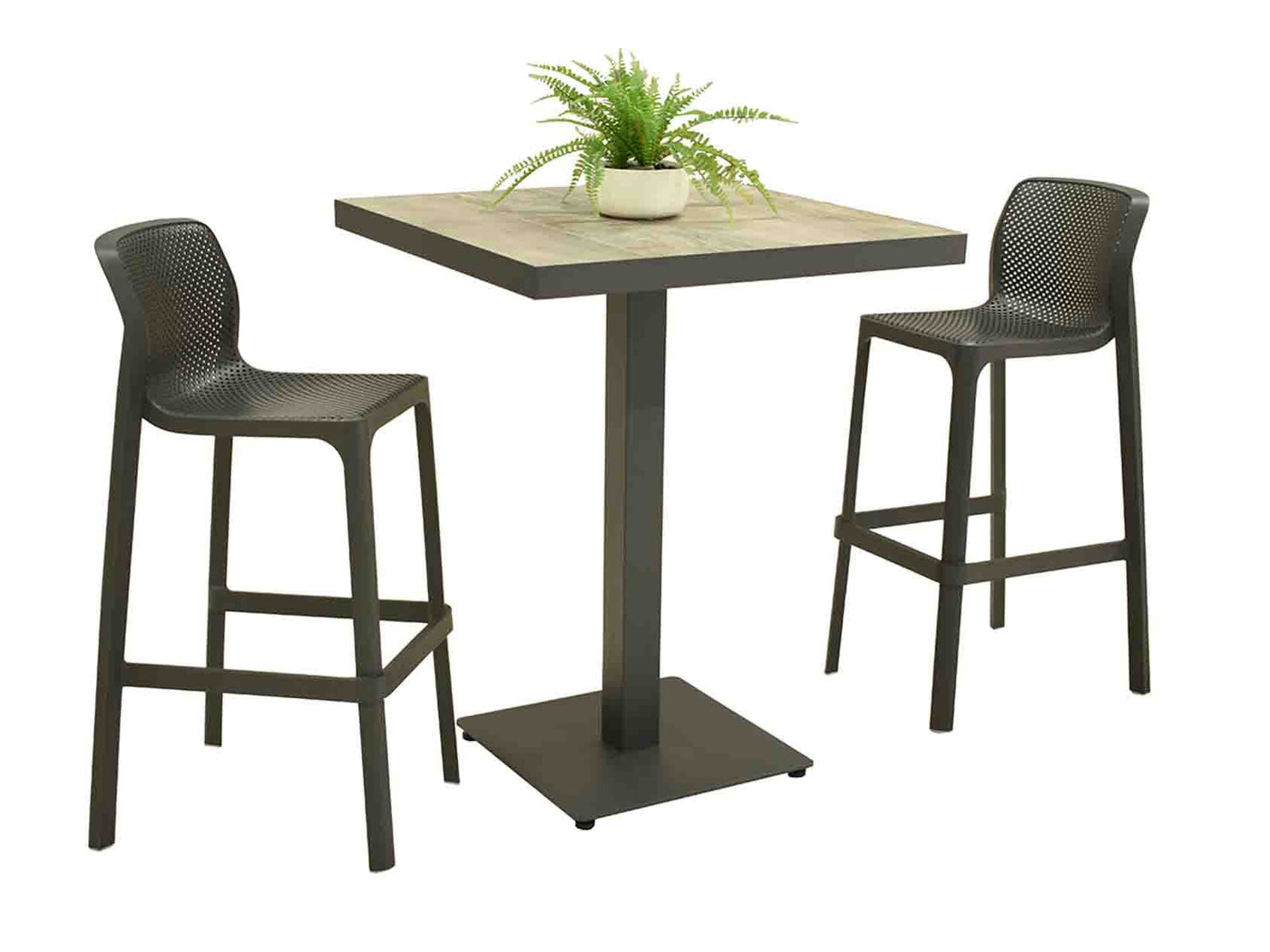 A square Clifton Bar Table with a wood-look ceramic top and a dark metal base, accompanied by two Nardi Net bar chairs with a unique perforated design. A small potted fern decorates the table.
