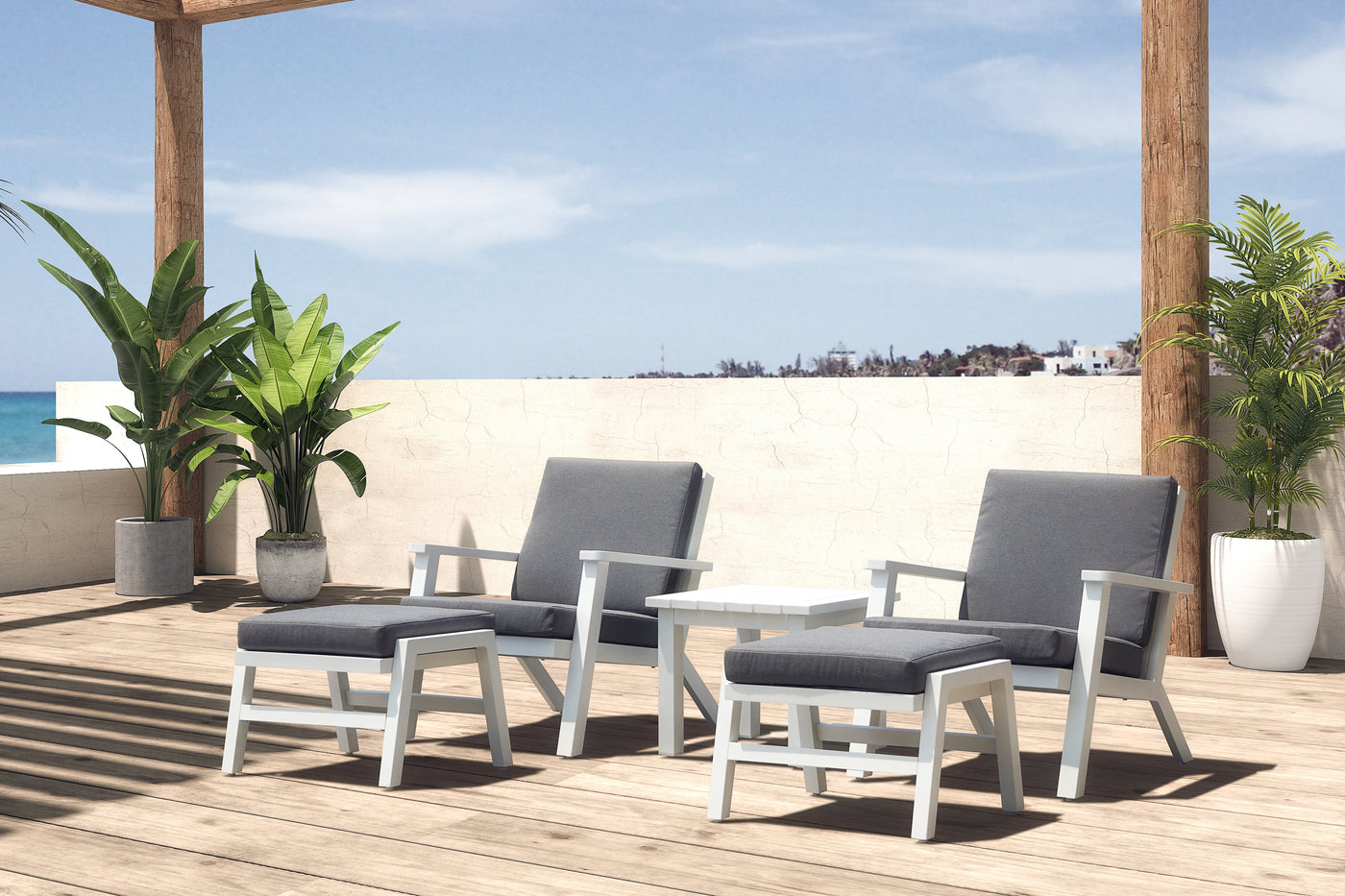 Balcony furniture with two sun loungers and a small coffee table in sunlight, set against a European backdrop with pot plants, creating a beachy vibe.