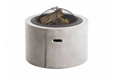 Circular grey concrete fire pit with wood inside, set against a plain white background, offering a stylish and durable outdoor heating solution.