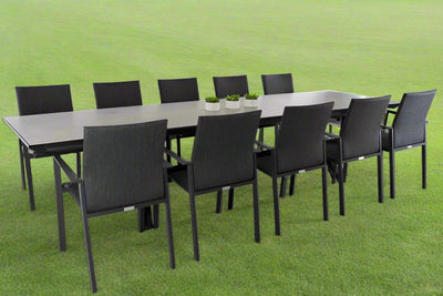 Aluminium outdoor dining set with ten aluminium chairs and a ceramic dining table, set on a grass field—perfect for modern outdoor dining.