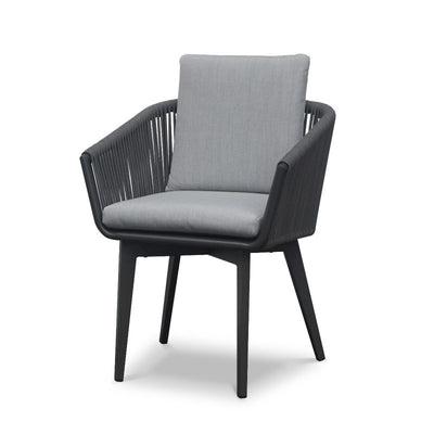 A modern charcoal-colored Truro outdoor dining chair with a black angular frame, gray cushioned seat, and backrest, featuring vertical rope detailing on the sides, against a white background.