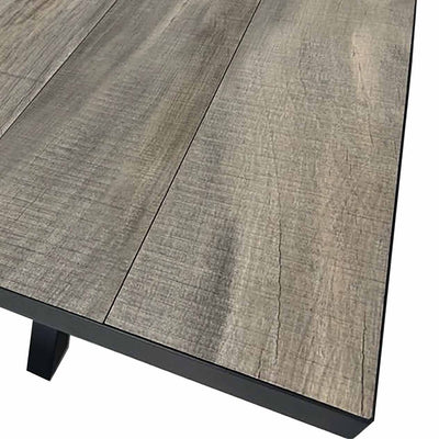 Close-up on the ceramic tabletop of an extendable outdoor dining table from the 'Clifton' range, perfect for alfresco furniture setups, displayed on a plain white background.