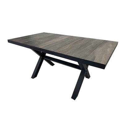 Black ceramic extendable outdoor dining table from the 'Clifton' range, perfect for alfresco furniture setups, displayed on a plain white background, viewed from a back angle.