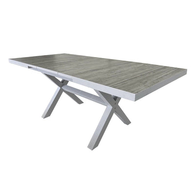 White ceramic extendable outdoor dining table from the 'Clifton' range, perfect for alfresco furniture setups, displayed on a plain white background, viewed from a back angle.
