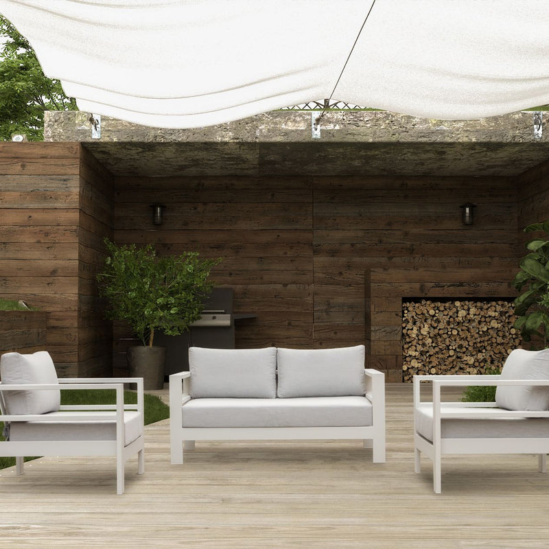 Albury outdoor furniture collection featuring a white couch and two chairs on a wooden deck, including an armchair, 2-seater, 3-seater, and modular settings with a protective cover, crafted from premium Spanish Agora fabric and aluminium.