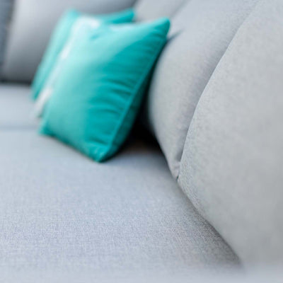 Close up of a durable aluminium outdoor furniture piece from the Alora range, featuring a comfy outdoor lounge with pillows, perfect for your outdoor living setup.