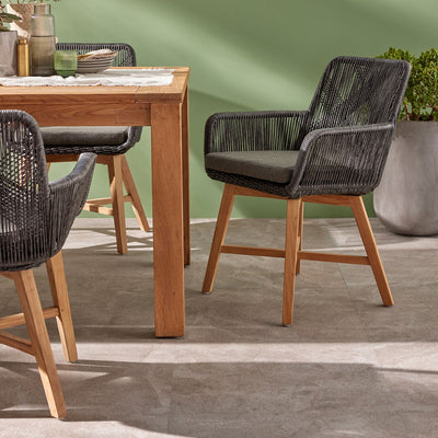 Outdoor furniture, outdoor dining furniture, wicker chair: A wicker dining chair with natural frame, charcoal fabric, and teak legs.