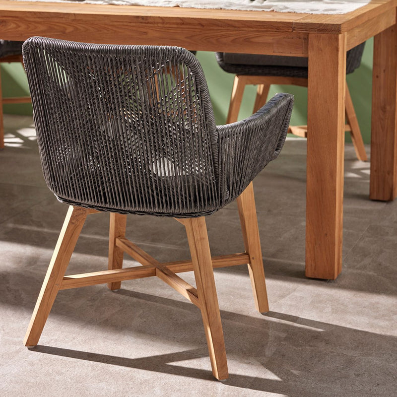 Outdoor furniture, outdoor dining furniture, wicker chair: A wicker dining chair with natural frame, charcoal fabric, and teak legs.