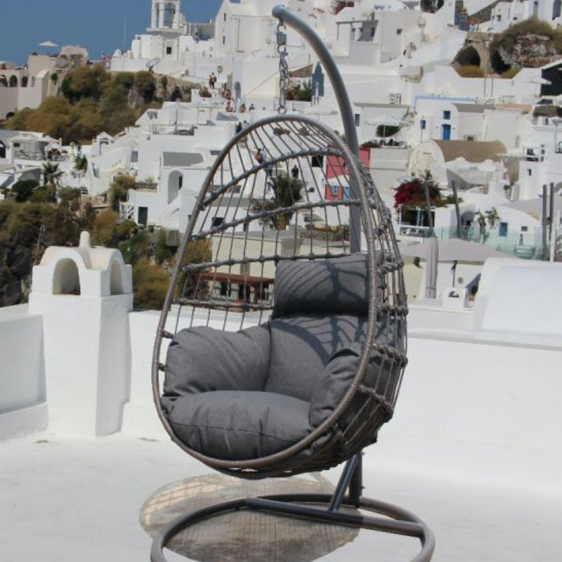 Dayton Hanging Swing Egg Chair, a piece of outdoor furniture with woven rope design and cushions.