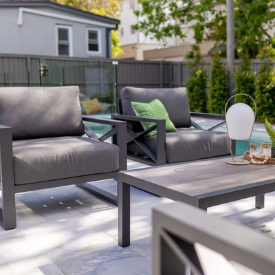 Aluminum outdoor furniture from Linear Lounge collection, including outdoor lounge chair and sofas, in a patio setting.