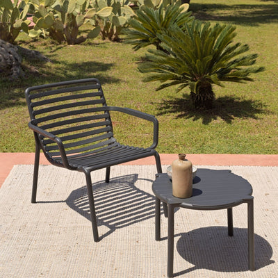 Designer Raffaello Galiotto's Doga Range outdoor furniture set with concrete table, made from recyclable resin.