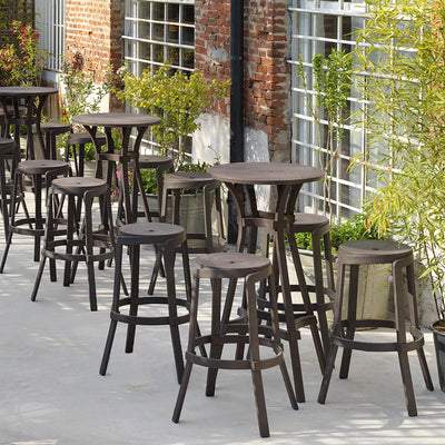 Stack Maxi Bar Stool by Nardi, a row of stools sitting on top of a sidewalk, perfect for outdoor furniture needs.