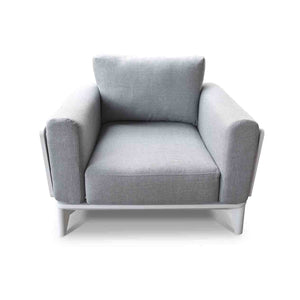 A single-seat outdoor armchair upholstered in grey fabric, viewed from the front. The sofa has white legs & frame and is placed against a plain white background.
