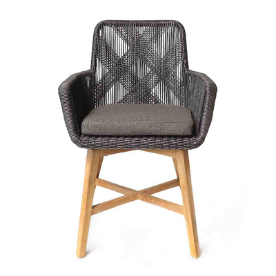 Outdoor furniture: A wicker dining chair with natural frame, charcoal fabric, and charcoal wicker set against a white background.