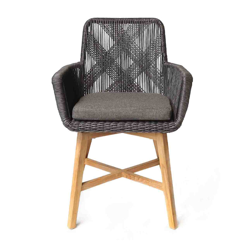 Outdoor furniture: A wicker dining chair with natural frame, charcoal fabric, and charcoal wicker set against a white background.