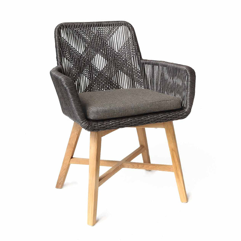 Outdoor furniture: A wicker dining chair with natural frame, charcoal fabric, and charcoal wicker set against a white background.