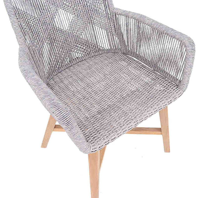 Outdoor furniture: A wicker dining chair with natural frame, light grey fabric, white wicker set against a white background.