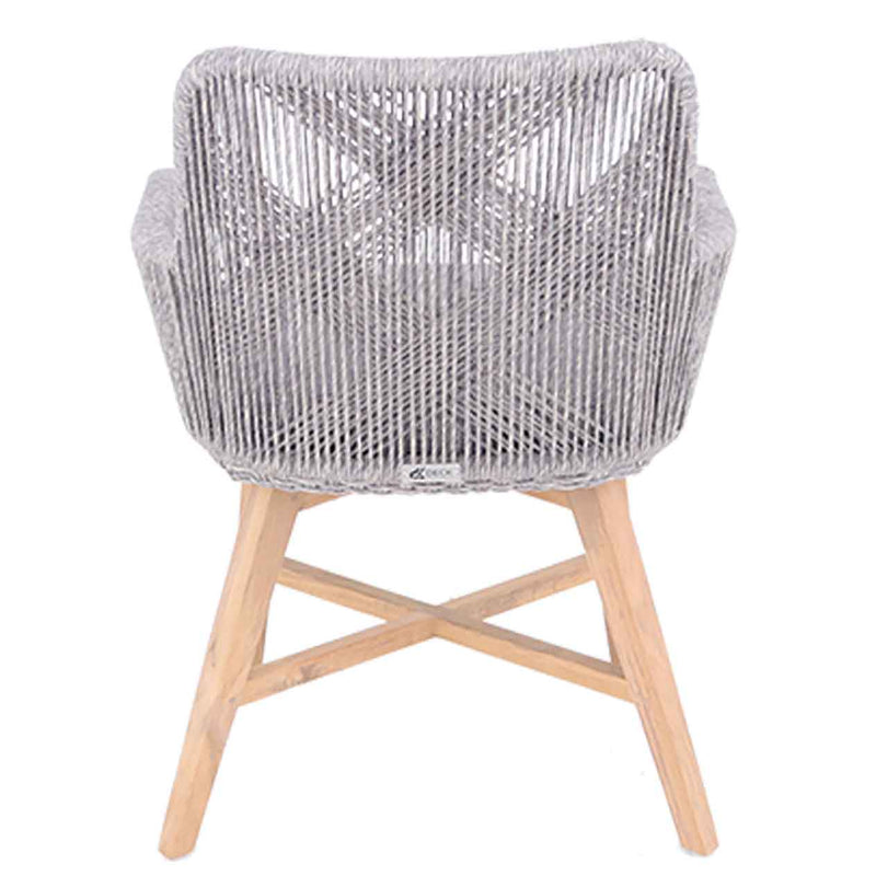 A back view of a wicker dining chair with natural frame, light grey fabric and white wicker set against a white background. This outdoor furniture piece is perfect for outdoor dining, featuring a whimsical wicker design.