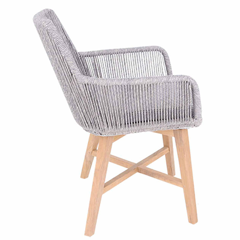 Outdoor furniture: A wicker dining chair with natural frame, light grey fabric, and white wicker set against a white background.