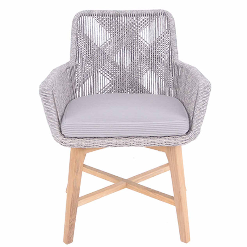 Outdoor furniture: A wicker dining chair with natural frame, light grey fabric, white wicker set against a white background.