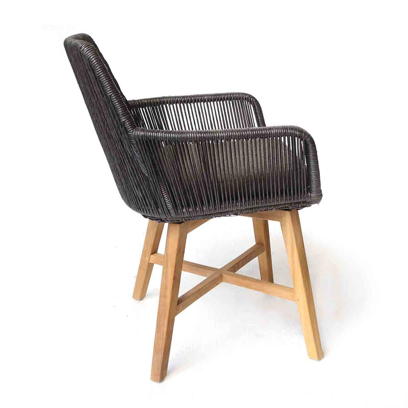Outdoor furniture: A wicker dining chair with natural frame, charcoal fabric, and charcoal wicker set against a white background.