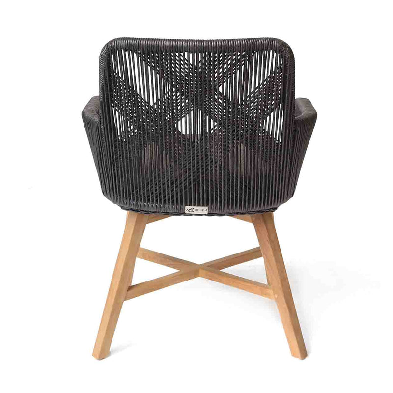 A back view of a wicker dining chair with natural frame, charcoal fabric and charcoal chair wicker set against a white background. Outdoor furniture, outdoor dining furniture, wicker chair.