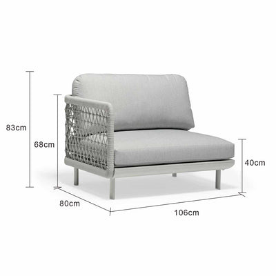 Outdoor furniture from the Colwood Collection featuring a wicker lounge chair, outdoor dining furniture, and a rope end chair with a light grey frame and cushion set against a white background.