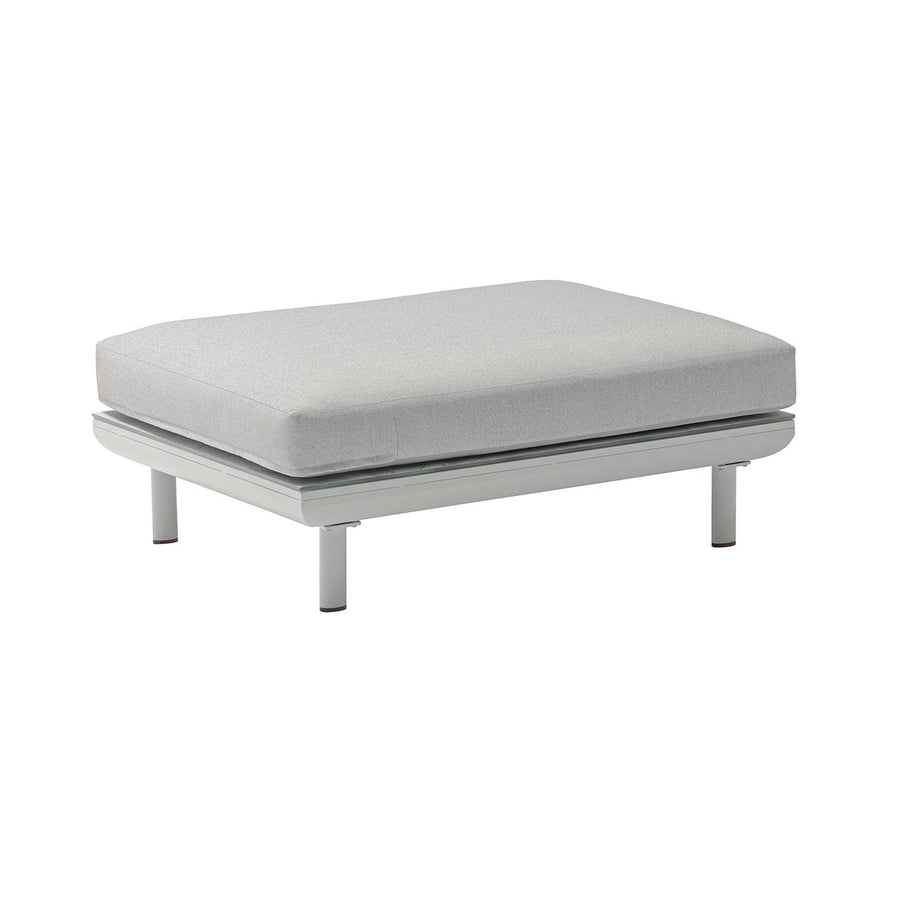 A sleek light grey ottoman with an aluminium frame set against a plain white background.