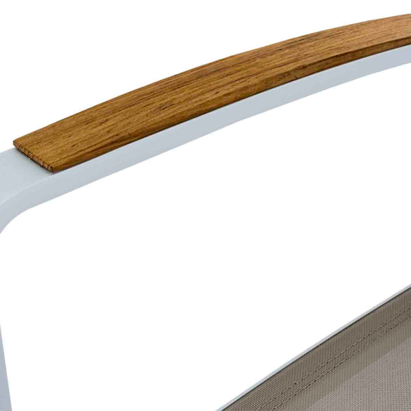 A close-up of an aluminium outdoor chair with teak arm, white frame, and khaki textilene. Outdoor furniture.