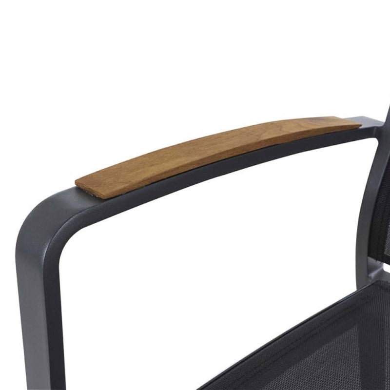 A close-up shot of an aluminium dining chair with teak arm, charcoal frame, and charcoal Textilene. Outdoor furniture, outdoor chairs, aluminium outdoor furniture.
