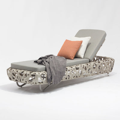 Beige wicker 'Rhodes' sun lounger, perfect for enhancing outdoor living spaces, displayed on a plain white background, viewed from a front angle.