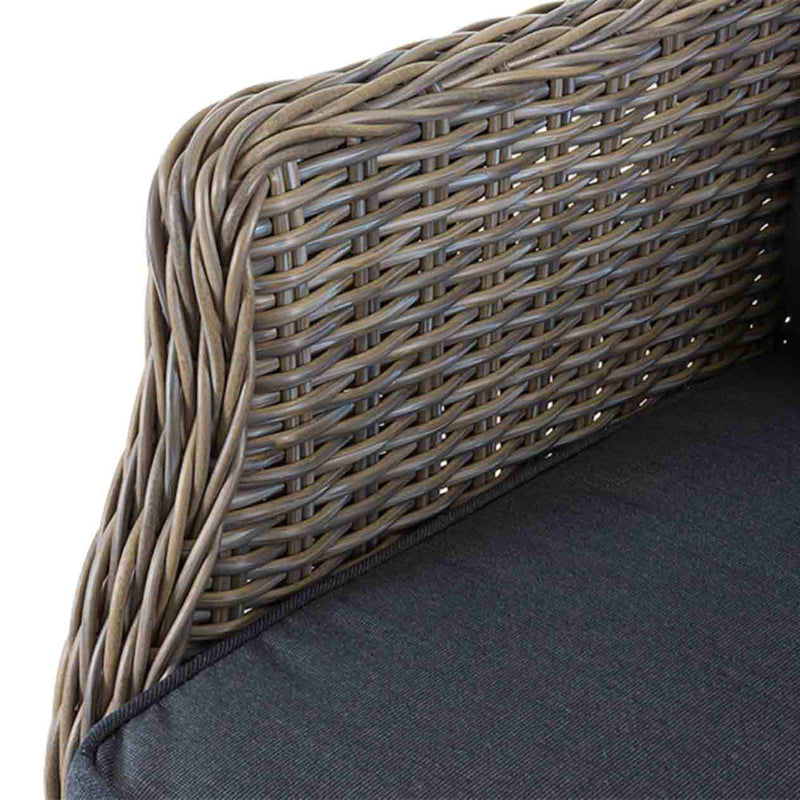 Close-up on the grey cushioned seating of a brown wicker &