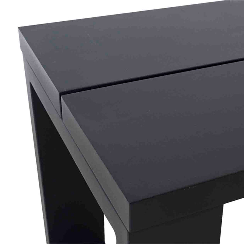 A close-up on the top of a black aluminium outdoor bench, which is displayed on a plain white background.