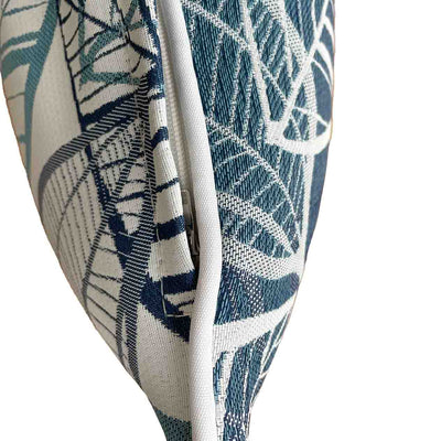 Close-up on the side of a blue, grey, and white outdoor scatter cushion with a lakeside-inspired leaf pattern design, perfect for outdoor furniture setups.