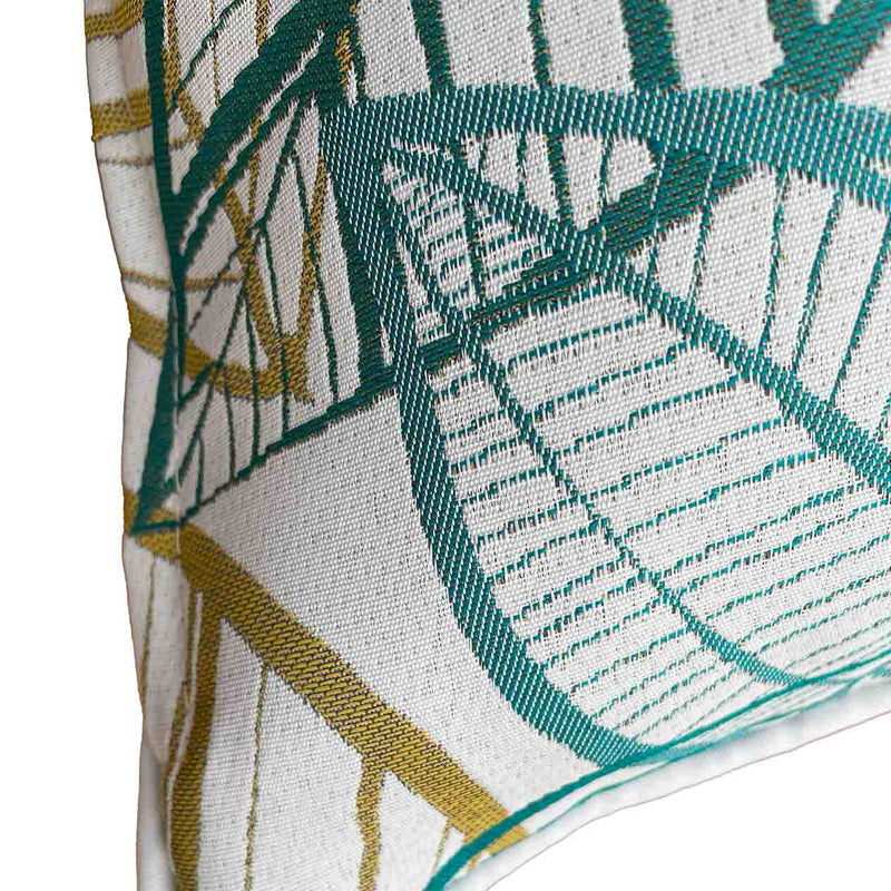Close-up on the side of an outdoor scatter cushion featuring a white, blue, and yellow Citron-inspired leaf pattern design, perfect for outdoor furniture setups.