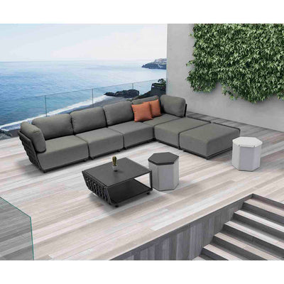 Six-seater outdoor rope modular lounge with matching coffee table, set in a sunny outdoor area overlooking the ocean, perfect for outdoor living.