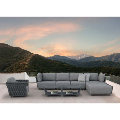 Seven-seater outdoor rope modular lounge with two matching coffee tables, arranged in a sunny outdoor space overlooking mountains during a warm sunset, ideal for outdoor living.