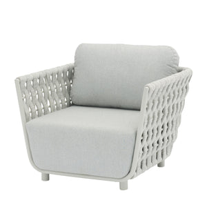 Outdoor furniture from the Lawson Collection featuring a white rope chair, outdoor lounge chair with a light gray cushion, and matching pieces.